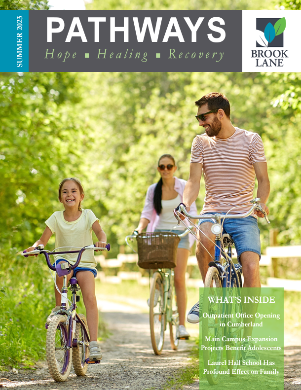 Family enjoying a bike ride in a park summer